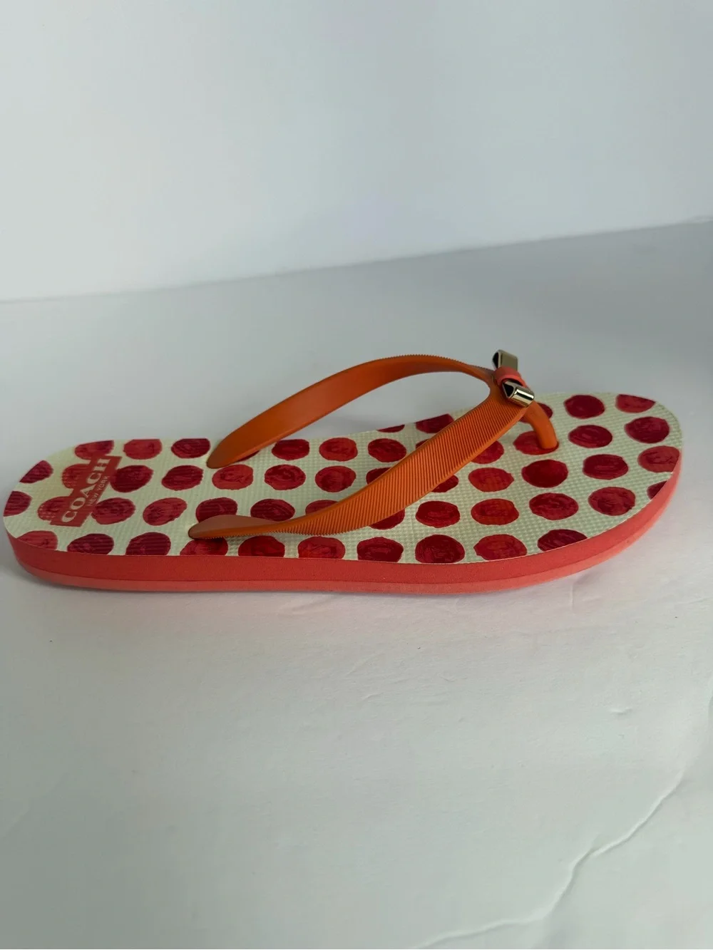 COACH Amel Coral Orange Polka Dot Flip Flops Sandals Gold Bow Women’s 7–8